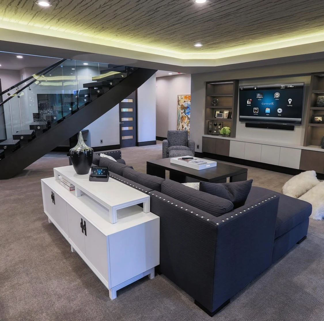 Media room with large TV and sectional sofa