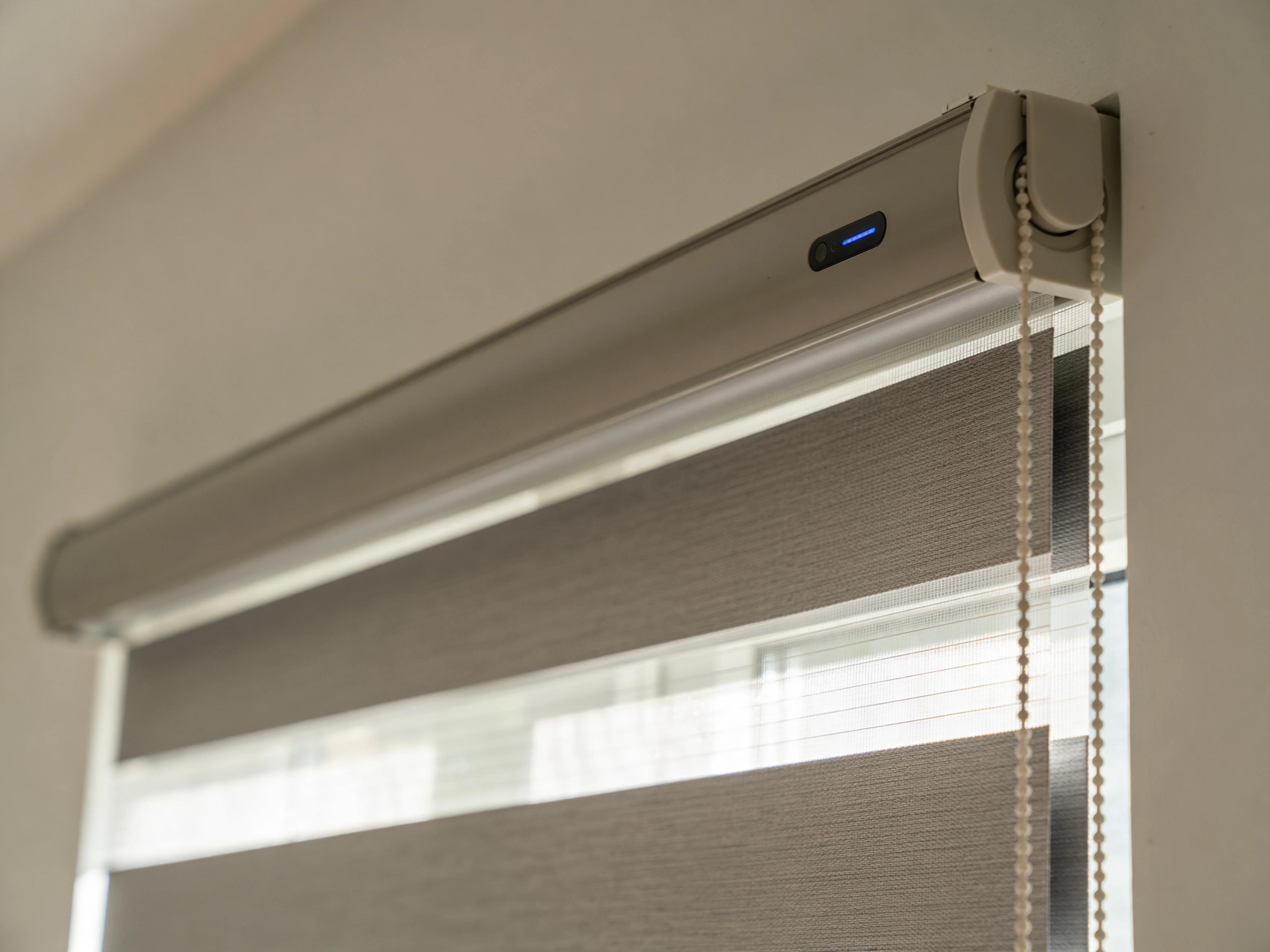 Close-up of a motorized roller shade